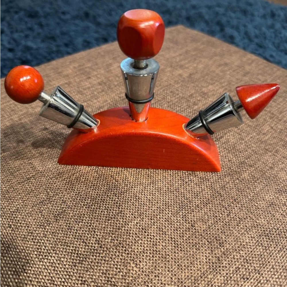 Wood and stainless steel wine stoppers